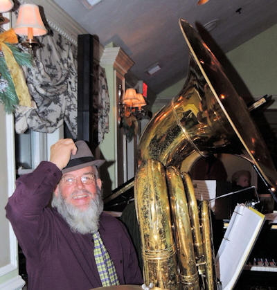 Al tipping his hat and smiling at us, behind that monstrous tuba