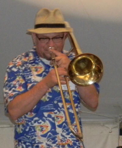Ben Griffin in straw hat on trombone